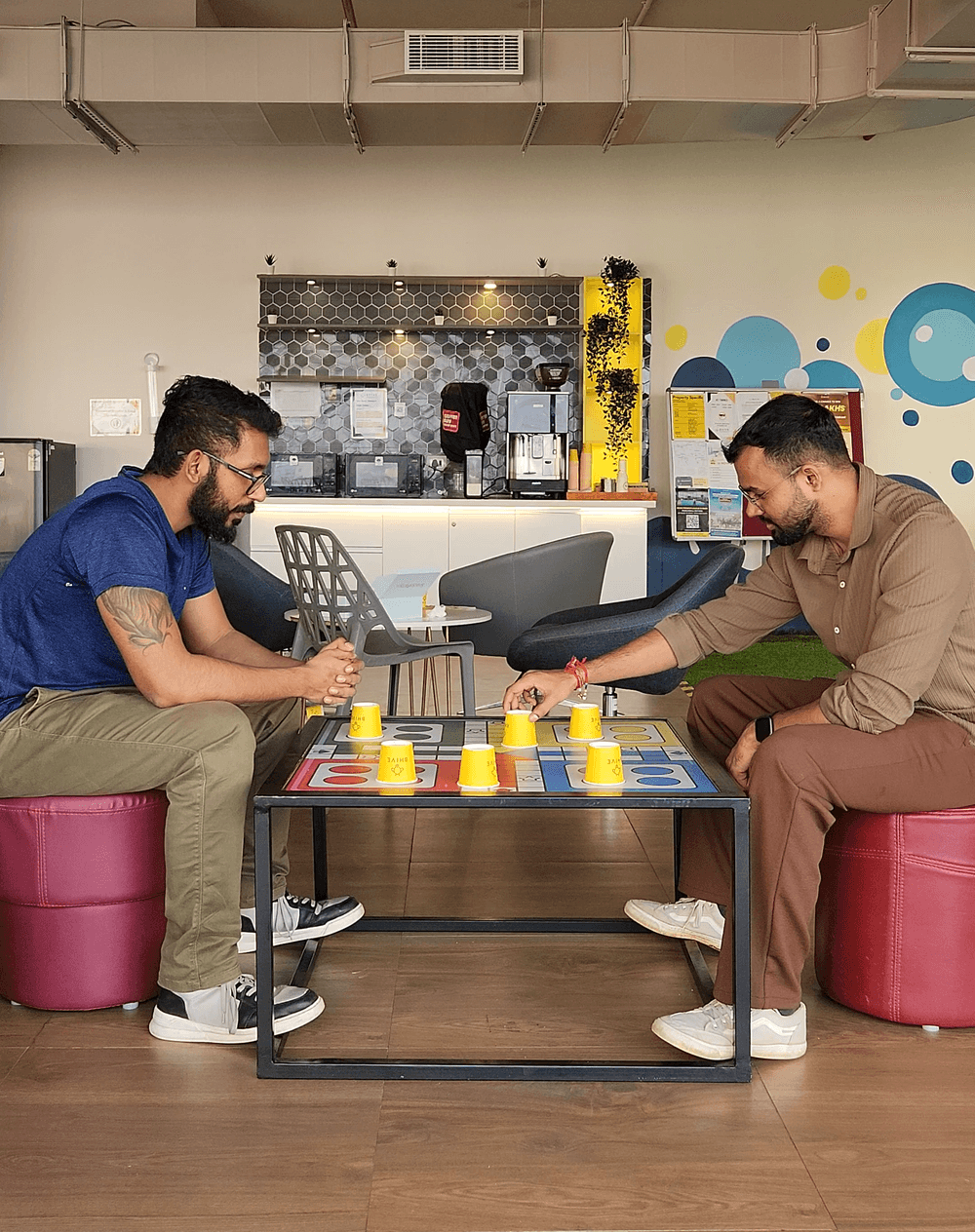 Rahul and his Neusearch AI co-founder Ankit at a table in their office