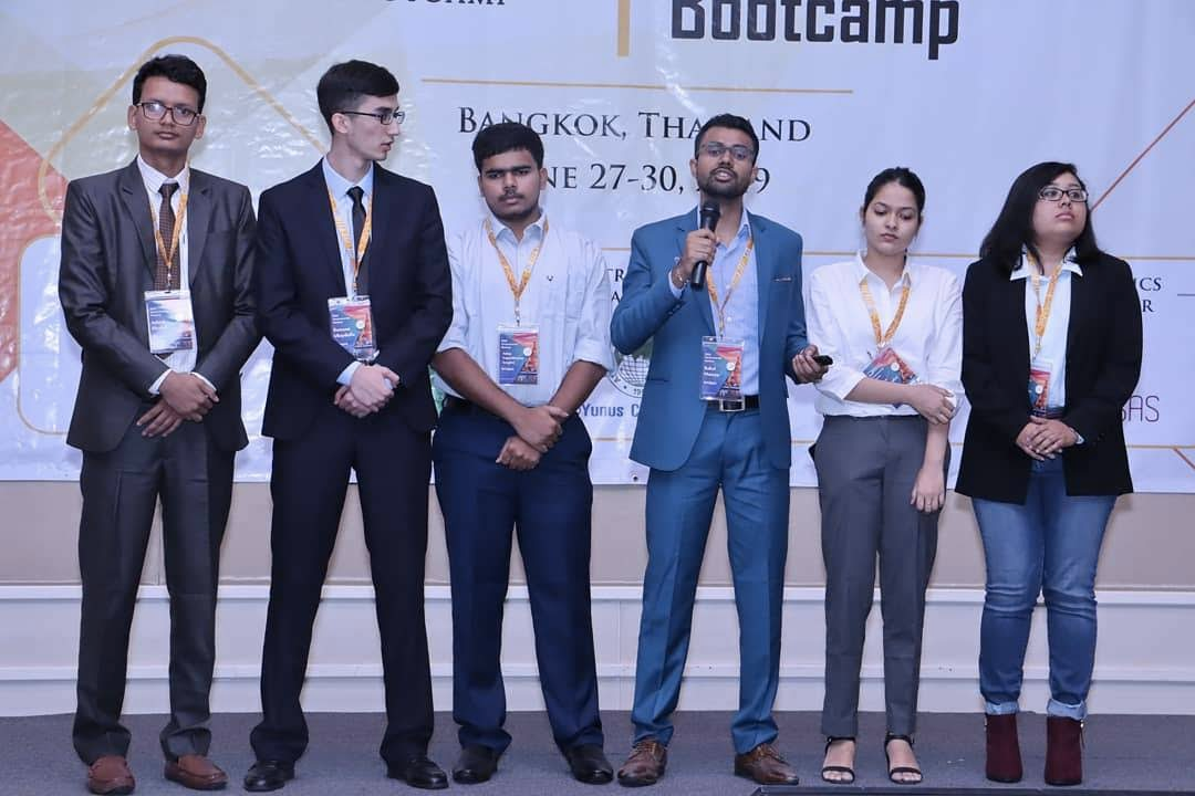 Rahul Maurya and teammates on stage at the Global Entrepreneurship Bootcamp in Bangkok, Thailand, June 2019